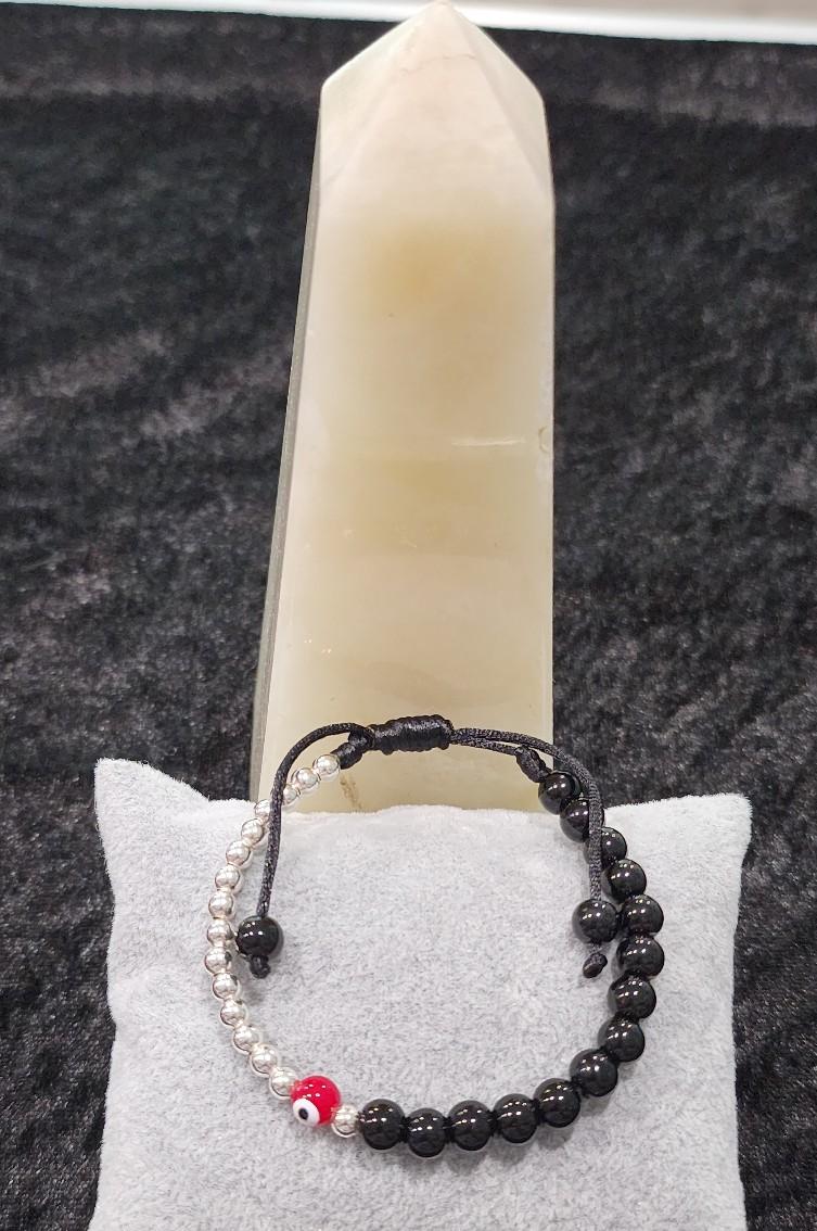 Pulsera ojo rojo y negro.Red and black eye bracelet.