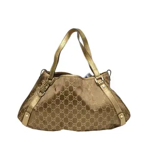 Pre-owned GUCCI leather Tote Bags Golden canvas, golden buttons, vintage sunglasses, handbag