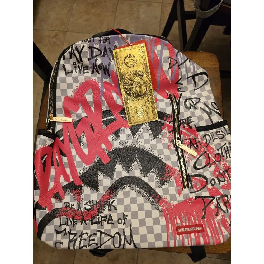 Sprayground Backpack with Graffiti Design and Gold Tag - Perfect for Daily Use and Style