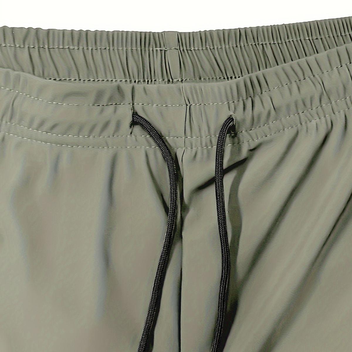 Men's casual stretchable ice silk fabric breathable waist drawstring, zipper pocket fashion sports capri pants with reflective print. Basic comfortable quick-drying breathable outdoor running, cycling, training and sports capri pants.