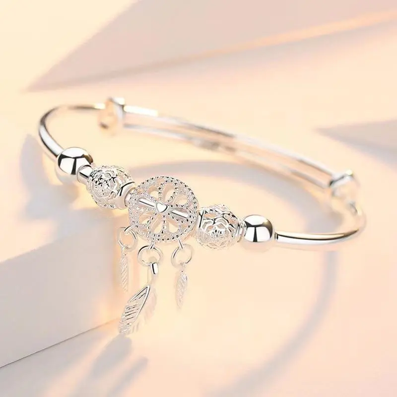 Hot-selling dream catcher feather silver push-pull button adjustable bracelet temperament summer ladies fashion copper bracelet.