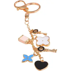 Keychain Charms with Gold Tone Accents and Assorted Charms Including Heart and Butterfly Designs