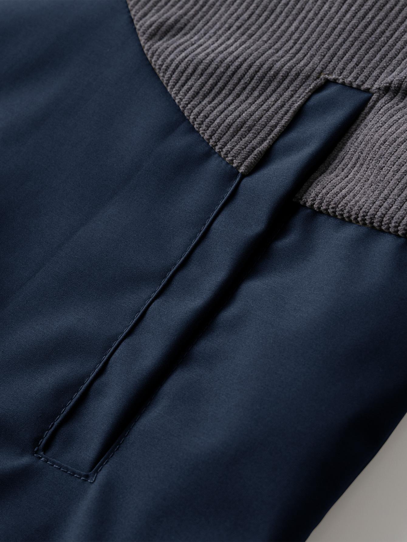 A collared jacket with a patchwork style, visually layered and designed to flatter necklines. The buttoned closure makes it easy to put on and take off. There is one pocket on the left side which is both practical and decorative