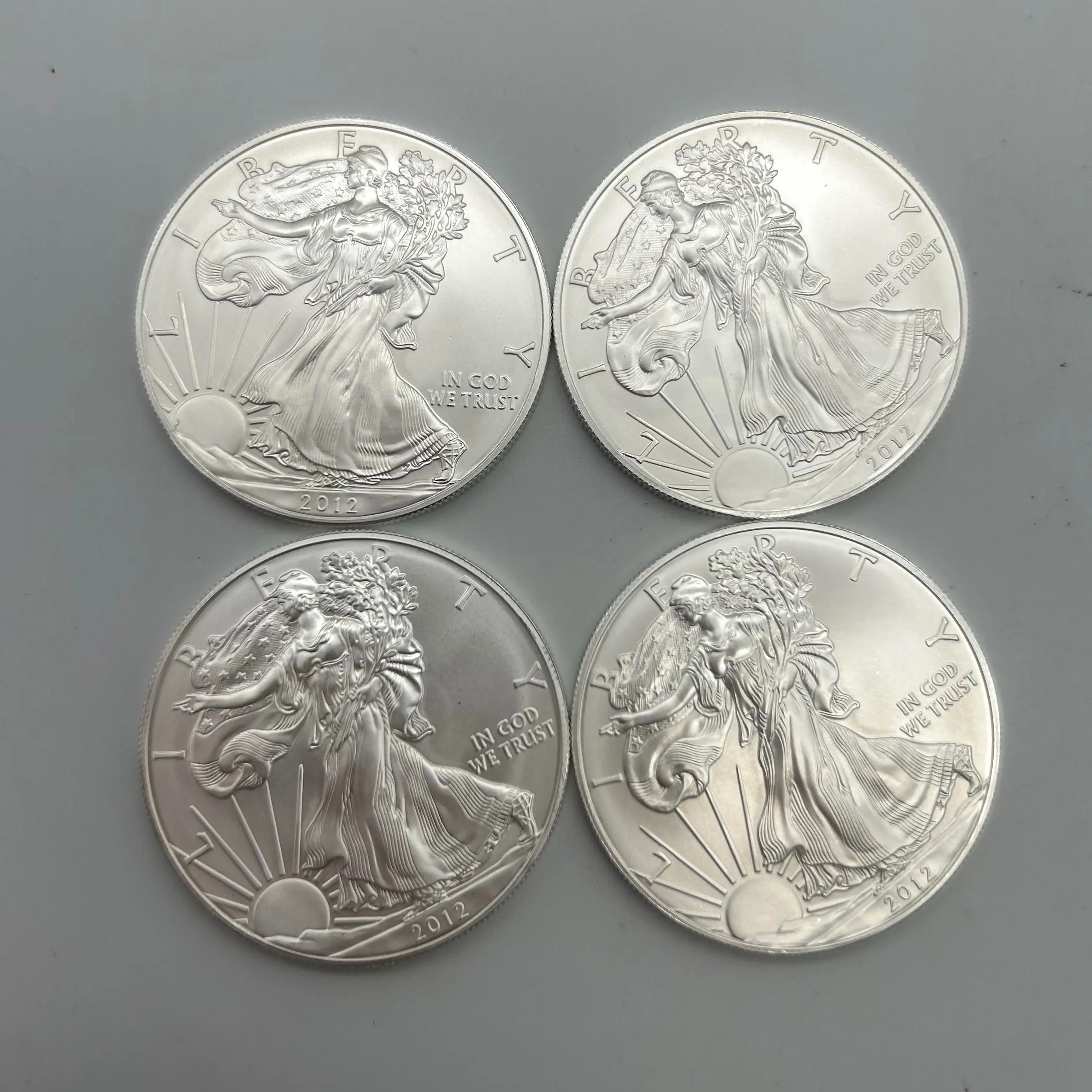 4 oz of silver in total has 4x 1oz silver rounds YEARS SHOWN IN HAND