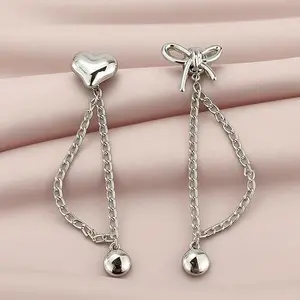 Pant leg fastening clip with chain for preventing pants from dragging on the ground, adjustable without sewing, button-style fastening for pants. Elastic waistband length reducer. 5 heart-shaped + 5 bow-shaped needle-type fasteners.
