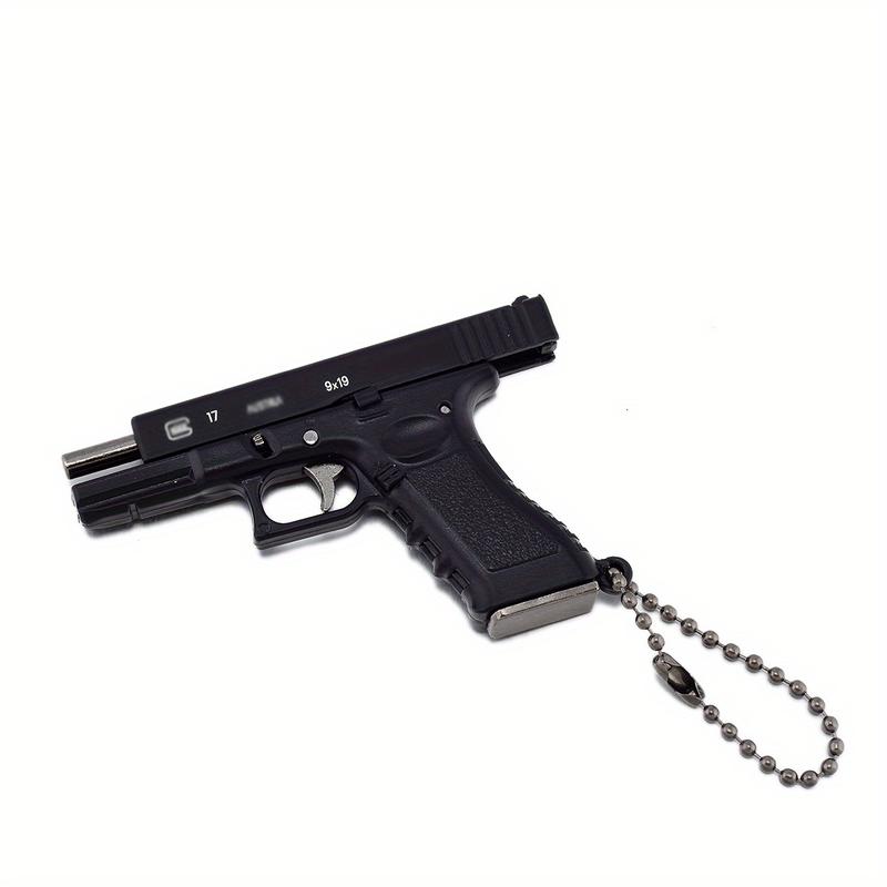1-Piece Classic 1:3 Scale Glock G17 Miniature Keychain – Tactical Military-Themed Mini Keychain Pendant. Exquisitely crafted with high wear resistance, superior hardness, and durable metal construction. Gaming Collectors