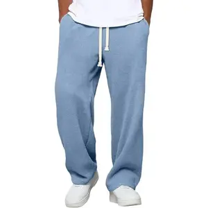 Men's loose-fitting sweatpants, waffle knit texture, loose cotton fabric, suitable for fitness and hiking, drawstring design.