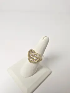 Heart shaped ring filled with cubic zirconia in 14k gold plating.