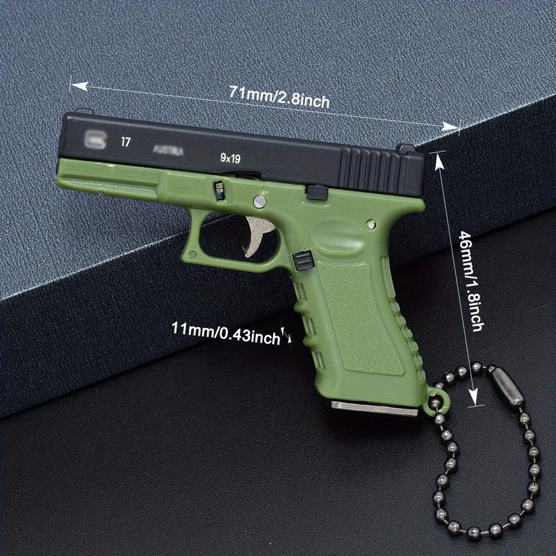 1-Piece Classic 1:3 Scale Glock G17 Miniature Keychain – Tactical Military-Themed Mini Keychain Pendant. Exquisitely crafted with high wear resistance, superior hardness, and durable metal construction. Gaming Collectors
