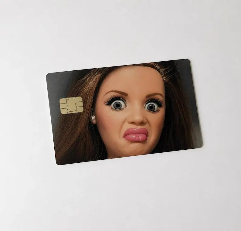 Funny Disgusted Doll Face Credit Card Skin | Hilarious Ugly Plastic Derp Meme | Sarcastic Debit Card Cover Sticker Wrap Universal Fit