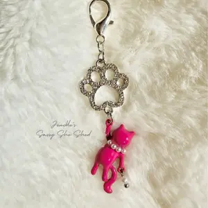 Pink Princess Kitty with pearl accents on rhinestone paw print bead clip on zipper charm for jackets and bags