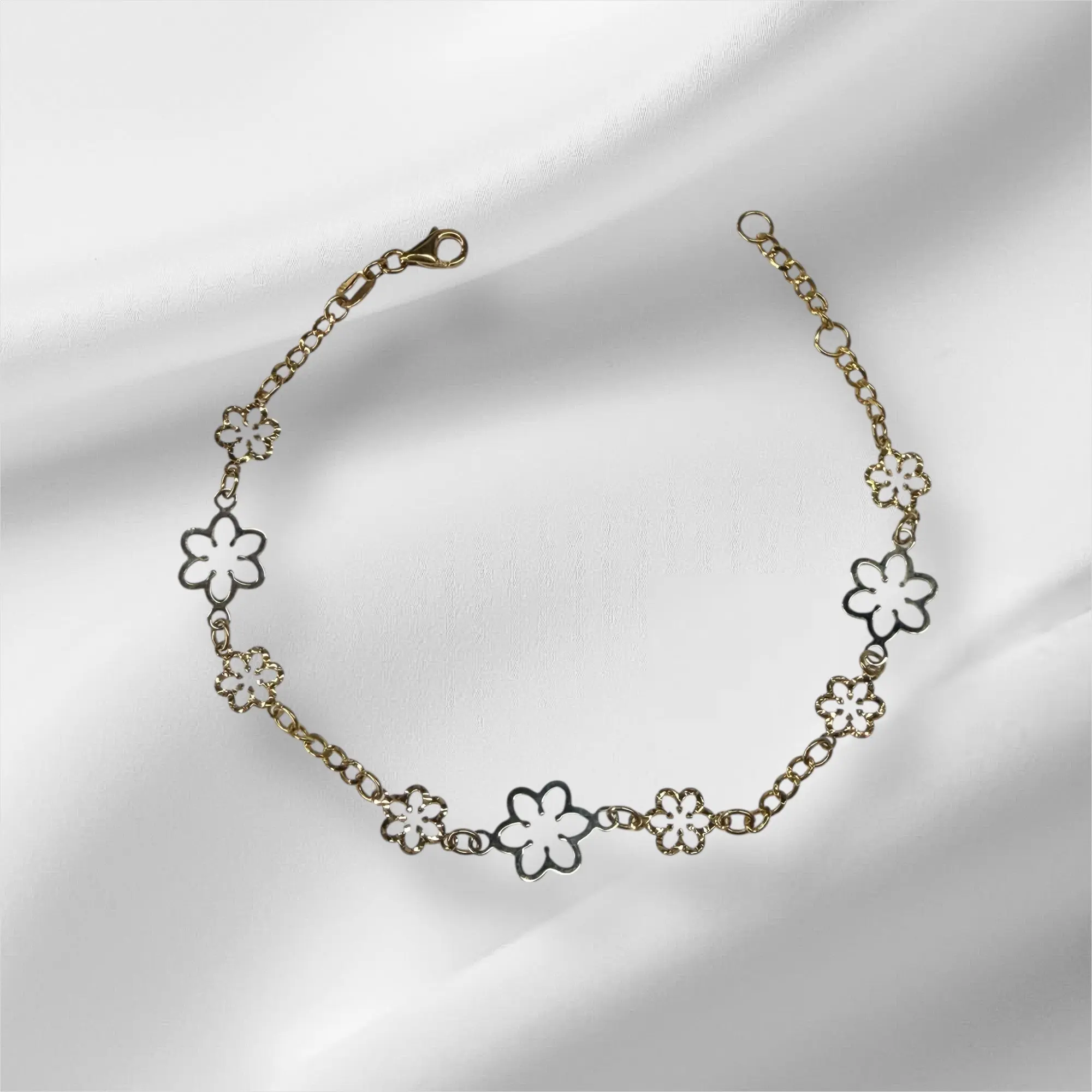 Esclava de flores de dos tonos oro 14k