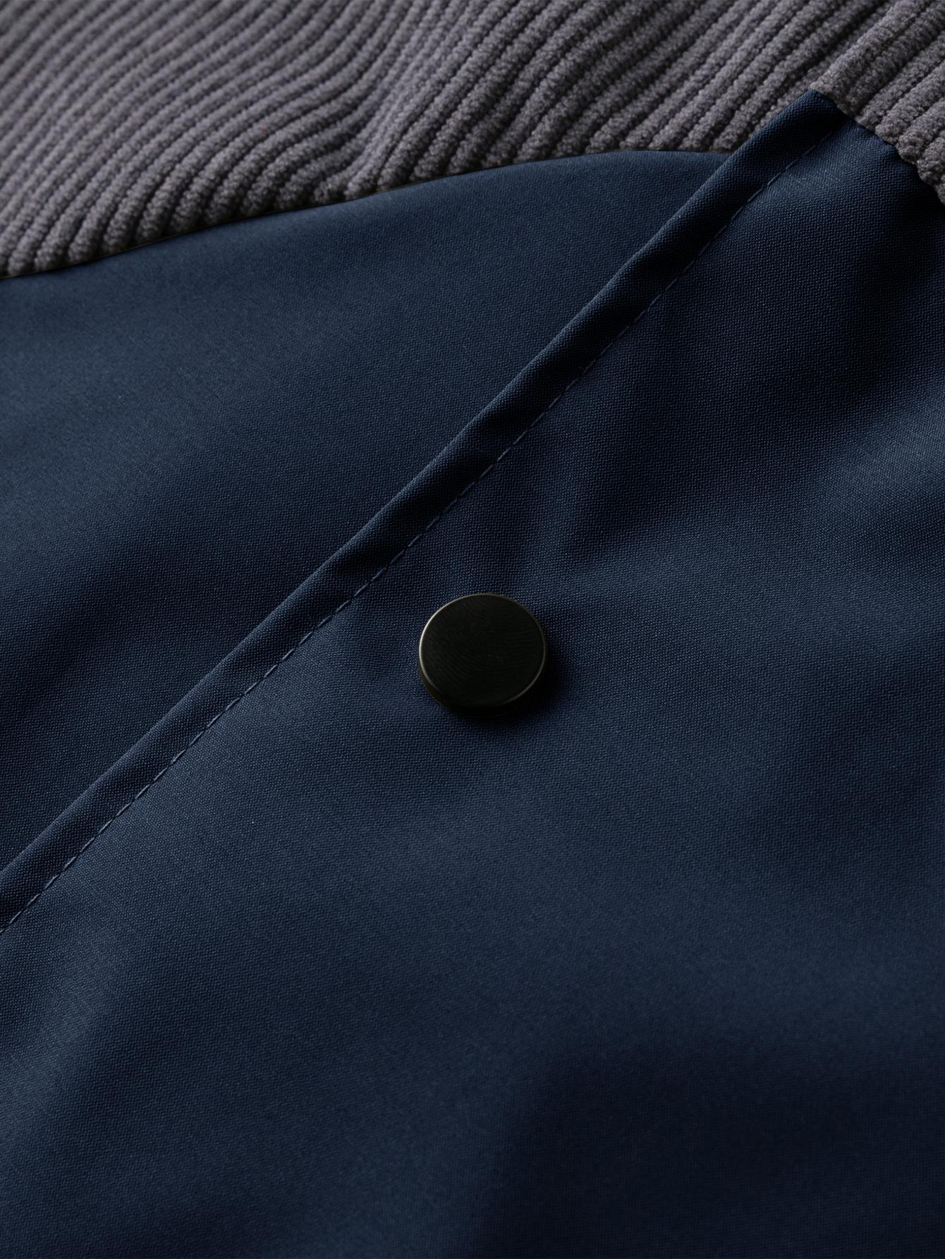 A collared jacket with a patchwork style, visually layered and designed to flatter necklines. The buttoned closure makes it easy to put on and take off. There is one pocket on the left side which is both practical and decorative