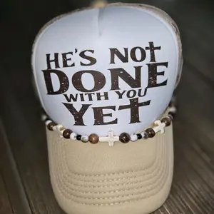 Hes Not Done With You Yet Cross designed trucker hat with custom chain