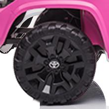 GARVEE Explore the GARVEE 12V Toyota Tacoma Ride-On Car, featuring spring suspension and vibrant LED lights, available in Pink, Black, White, and Red, perfect for adventurous young drivers.