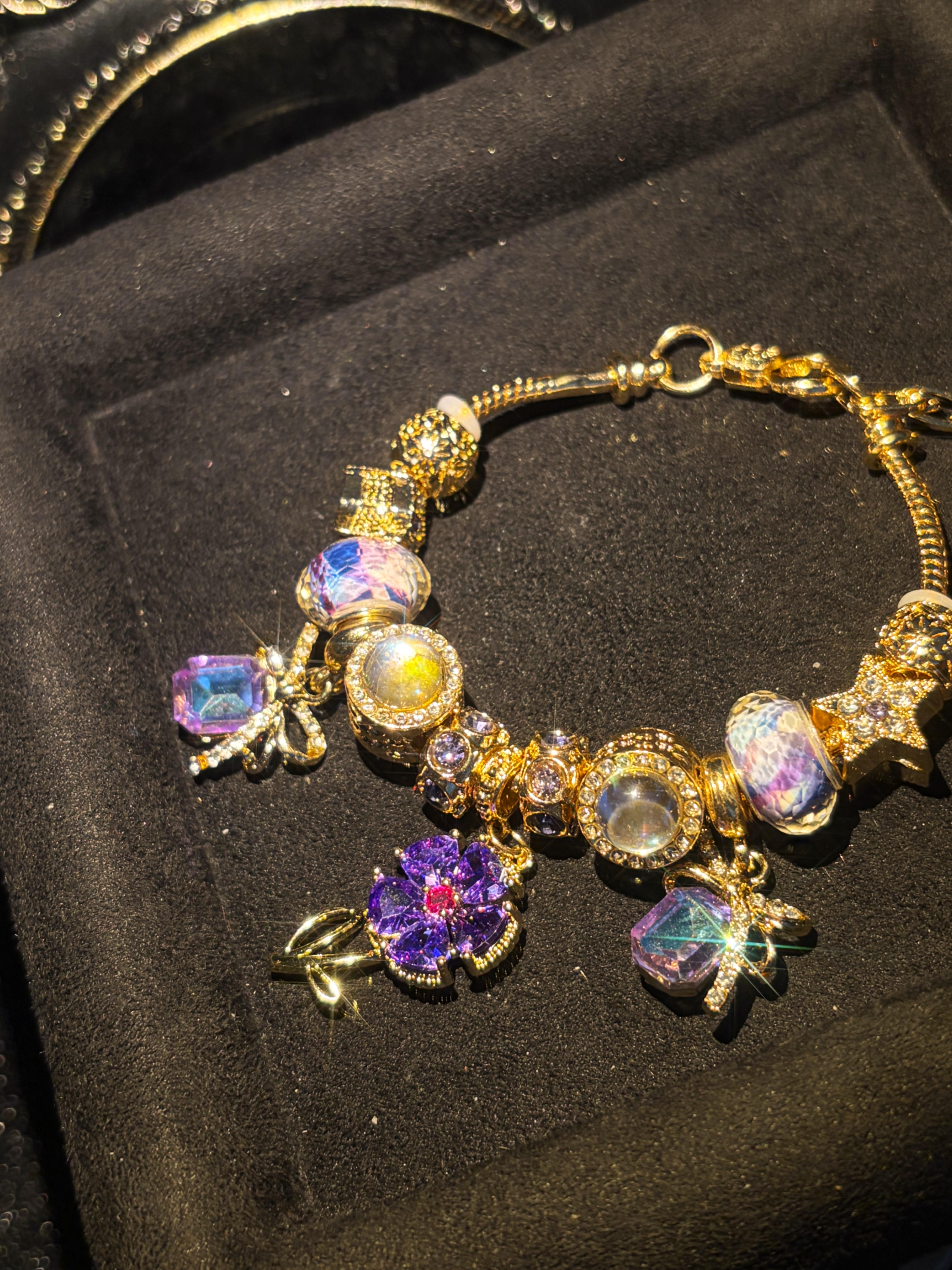 Women's Gold-Tone Purple Flower Charm Bracelet - Iridescent Crystal, Bow Star Pendants, Adjustable Length, Vintage Luxurious Statement Jewelry, Party Ready Costume Accessory Women's Gold-Tone Purple Flower Charm Bracelet - Iridescent Crystal, Bow Star Pendants, Adjustable Length, Vintage Luxurious Statement Jewelry, Party Ready Costume Accessory