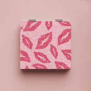 Mirror with Pink Lipstick Pattern for Stylish Makeup Application