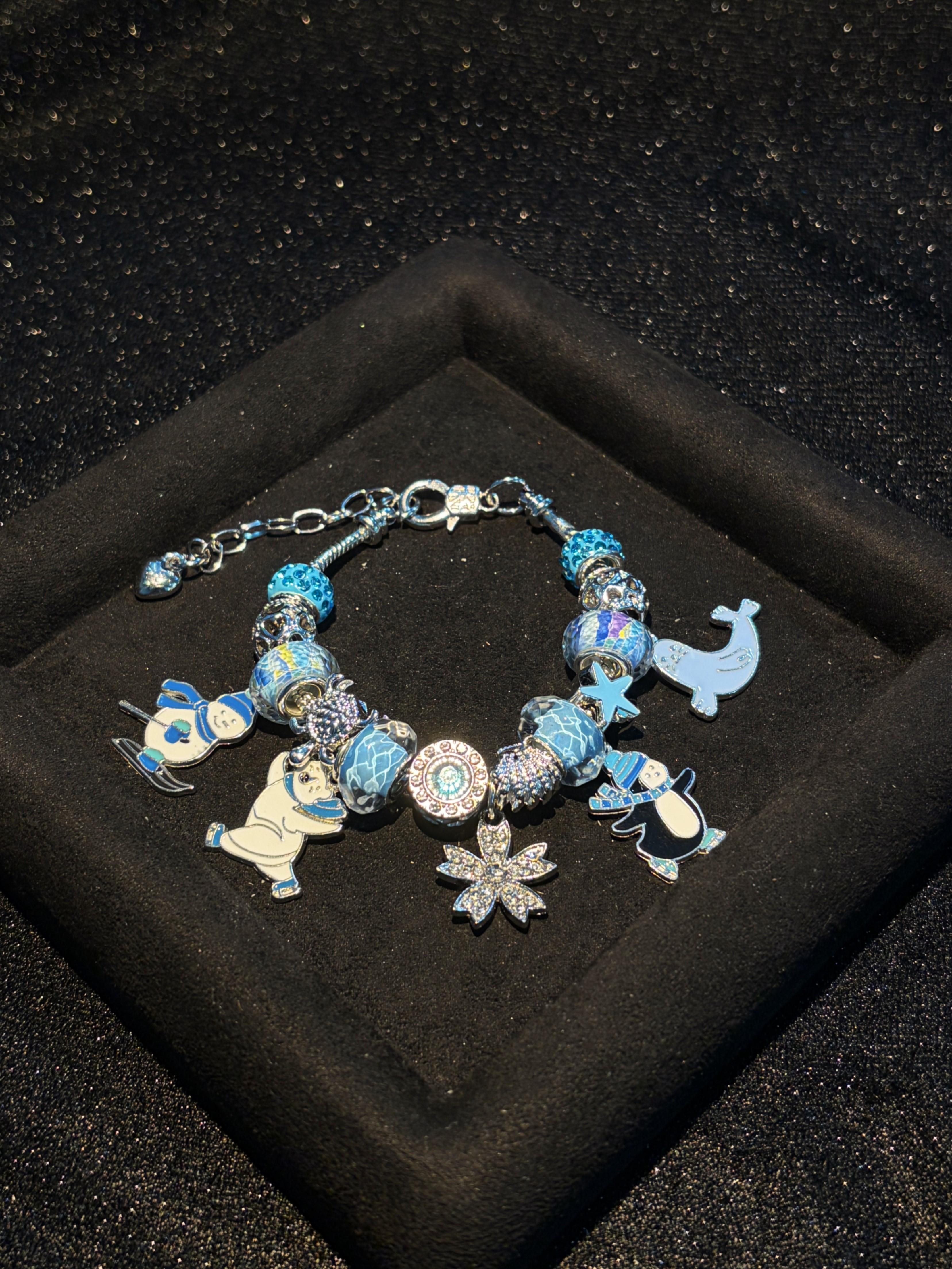 Women's Adjustable Silver-Tone Snake Chain Bracelet with Water-Ripple Blue Beads, Animal Snowflake Pendants and Removable Large Hole Beads Costume Jewelry Women's Adjustable Silver-Tone Snake Chain Bracelet with Water-Ripple Blue Beads, Animal Snowflake Pendants and Removable Large Hole Beads Costume Jewelry