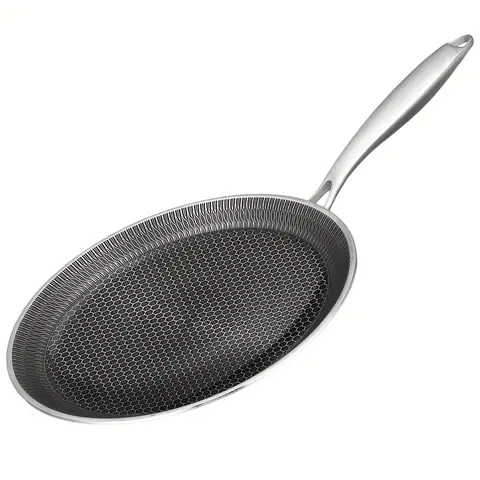 A Sleek Stainless Steel Frying Pan That Is Lightweight, Features a Non-Stick Surface, Works with Both Induction And Gas Stoves, Ensures Even Heat Distribution, And Is Easy to Clean, Perfect for Cooking Steak, Eggs, Fish, Pasta, And Pizza