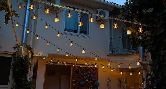 Solar-powered outdoor string lights for Christmas decorations (flame effect), 15 bulbs (32 feet) patio lights, waterproof warm white light, ideal holiday gift for decorating Christmas trees, Christmas parties, gardens, patios, and fun decorative lights.