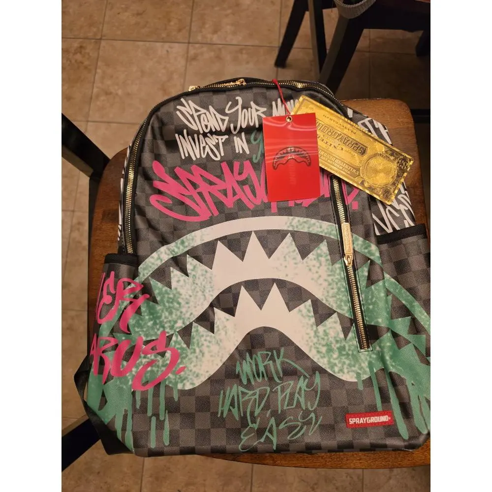 Sprayground Shark Mouth Backpack with Graffiti Design and Zipper Closure