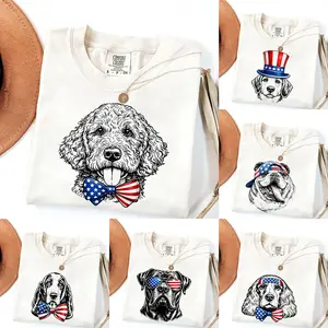 Comfort Colors Puppy Love Dog T-Shirt featuring 50 breeds in a festive 4th of July graphic, a cute Independence Day pullover for devoted dog lovers.