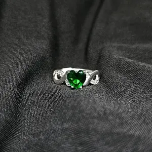Heart-Shaped Green Gemstone Ring with Infinity Band
