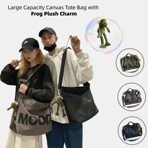 Large Capacity Canvas Tote Bag with Frog Plush Charm Casual Street Crossbody Handbag for Everyday Use unisex ,Couple bag,Great Gift Choice Ideal gift for birthdays, holidays, or casual everyday use.