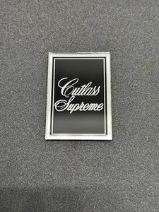 1978 1979 Oldsmobile Cutlass Supreme Header Panel Emblem Cutlass Supreme Black and Chrome