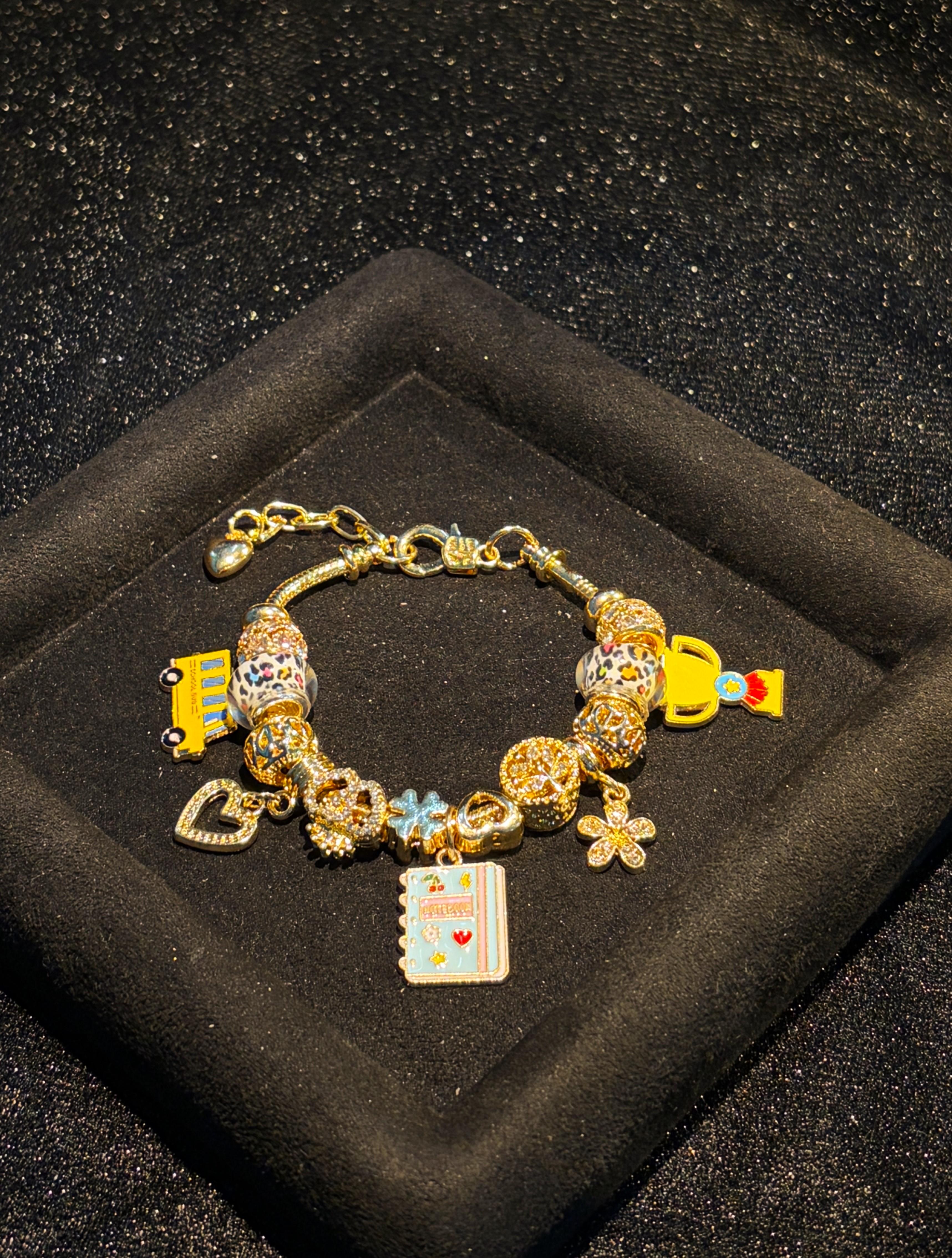 Girls' Gold-Tone Adjustable Snake Chain Back to School Charm Bracelet with School Bus, Notebook, Trophy Dangle Charms, Enamel Beaded Costume Jewelry Gift Girls' Gold-Tone Adjustable Snake Chain Back to School Charm Bracelet with School Bus, Notebook, Trophy Dangle Charms, Enamel Beaded Costume Jewelry Gift