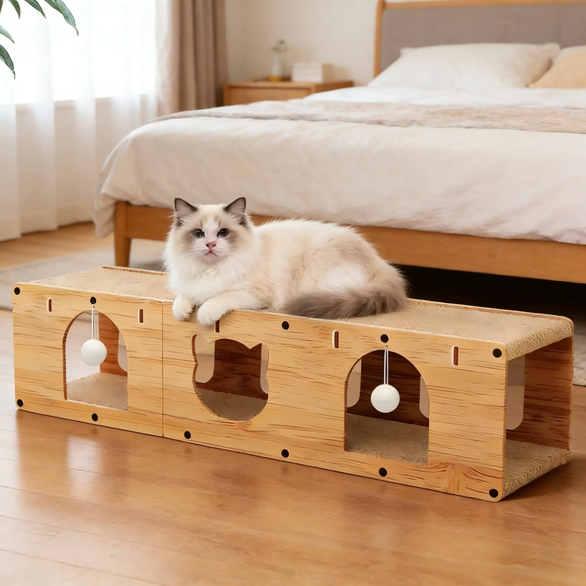 Large Cardboard Cat Scratcher Playhouse – a multi-functional indoor cat tunnel with scratching pads  toy tracks  and balls  Features an innovative  safe eco-friendly  and ventilated design for easy assembly  Includes wooden internal toys for extra play ti