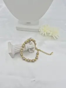 14k gold plated beaded bracelet with zirconia. (97)