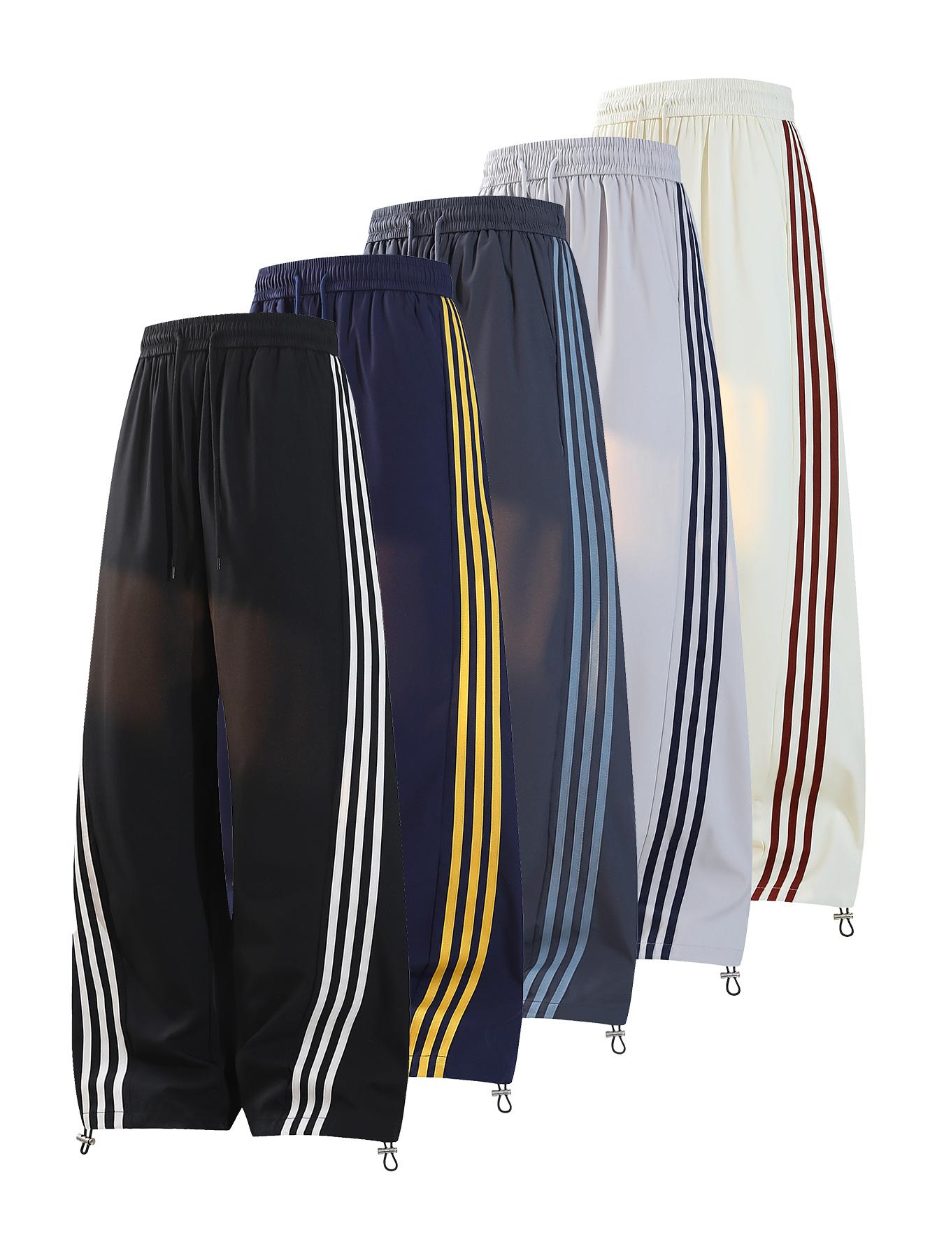 CCCMAI Men's color-block side stripe sports pants, all-season men's casual fashion trendy straight-leg pants with drawstring waistband, classic menswear sweatpants, loose casual pants, stylish activewear for men. Striped