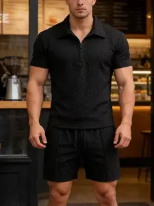 The modern men's half zipper short sleeved shorts set is made of delicate full width diamond stitched fabric, presenting a smooth monochrome style with a soft texture