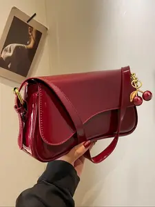 Retro wine red patent leather shoulder underarm bag, metal buckle cherry pendant, fashionable, exquisite and versatile, full of sweetness and coolness, niche design suitable for daily travel, shopping and dating, etc.