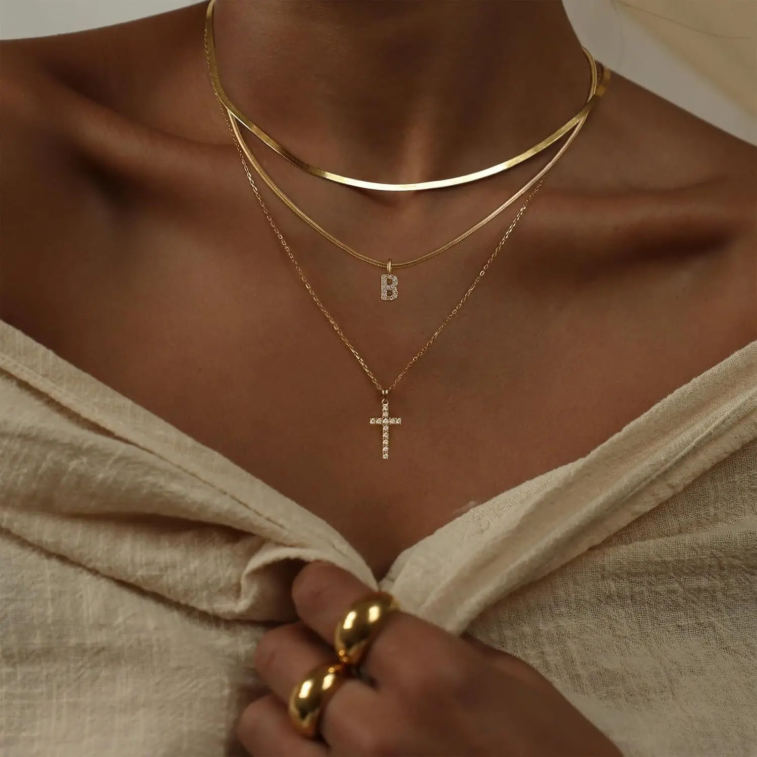 TASISO Layered Gold Necklaces for Women  Tiny Initial Necklaces 14K Gold Plated Stackable Necklaces with CZ Cross Design Safety Pin Necklace Chains