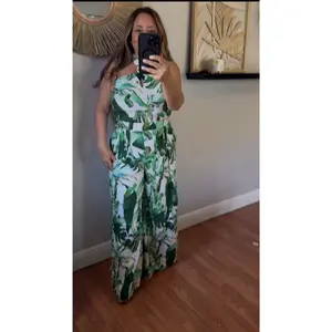 EMERALD TIDE HALTER JUMPSUIT