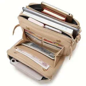Magnetic snap closure three-layer leather bag; credit card slots; multiple zippered pockets.
