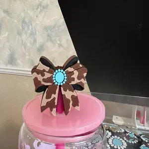 Western bow with turquoise straw topper