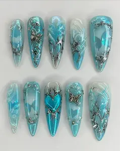 Aqua Blue Chrome Nail Art with 3D Silver Butterfly Charms, Sculpted Heart Accent and Glossy Ocean Inspired Swirls for a Bold Icy Glam Statement Set