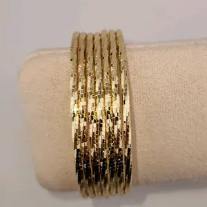 97 - Elegant Gold-Tone Semanarios Set - 7-Piece Stackable Bangles for Women's Fashion Accessories