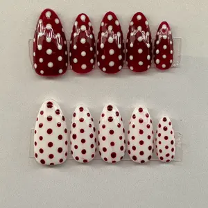Red and white polka dot nails