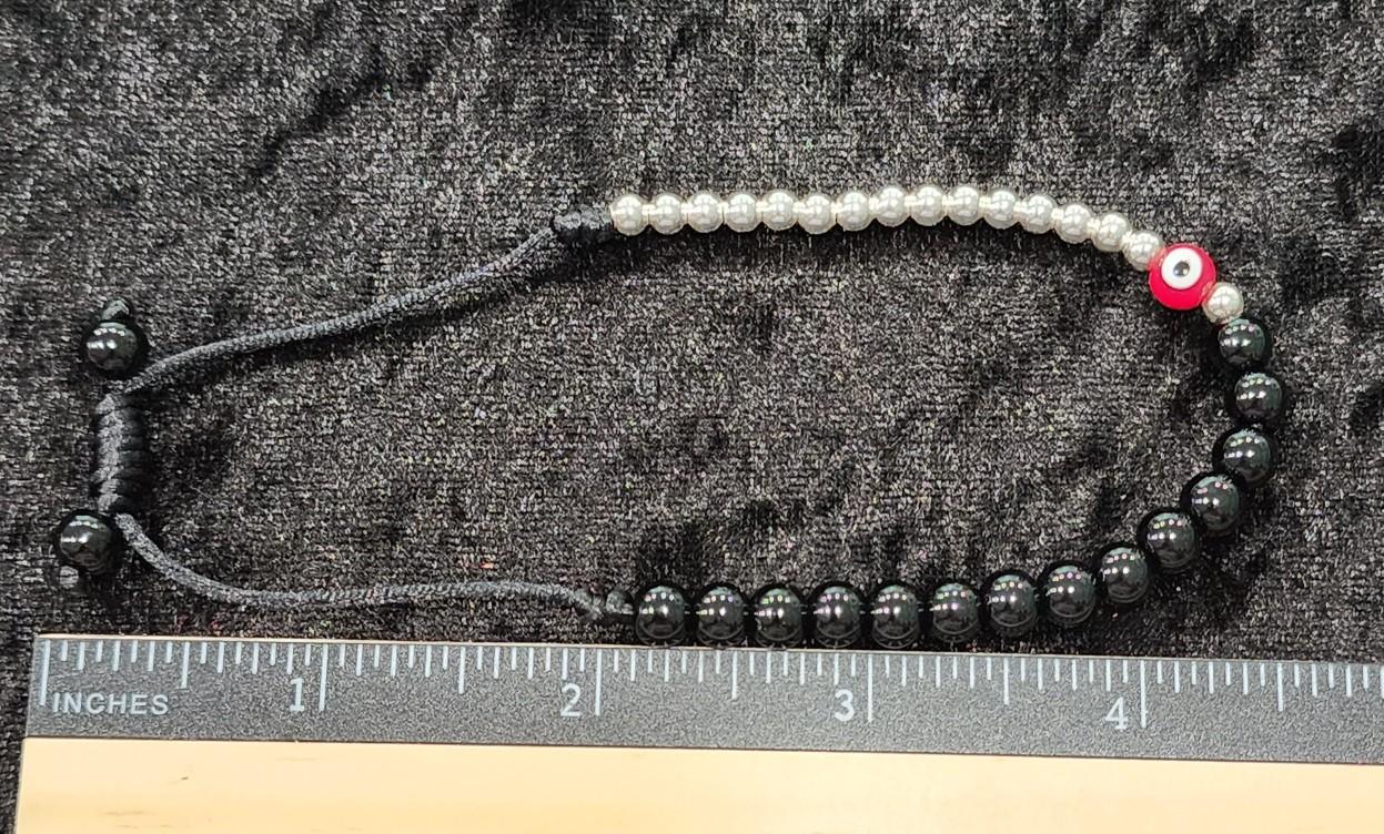 Pulsera ojo rojo y negro.Red and black eye bracelet.