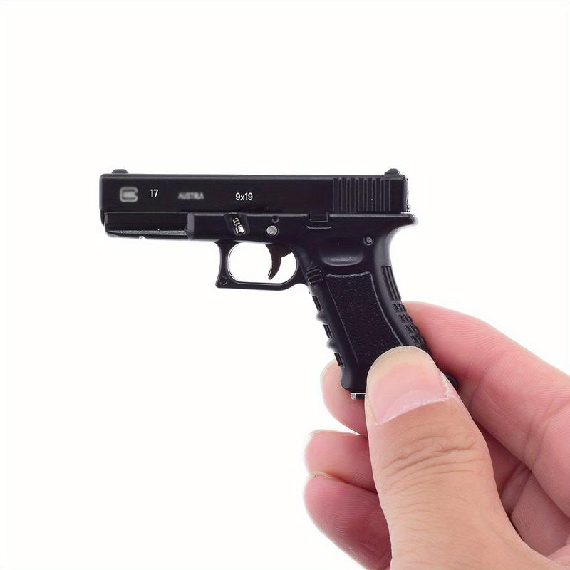 1-Piece Classic 1:3 Scale Glock G17 Miniature Keychain – Tactical Military-Themed Mini Keychain Pendant. Exquisitely crafted with high wear resistance, superior hardness, and durable metal construction. Gaming Collectors