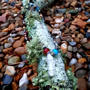 Clear Quartz crystal necklace with beaded patterns, 23.5in length. Locally sourced crystals