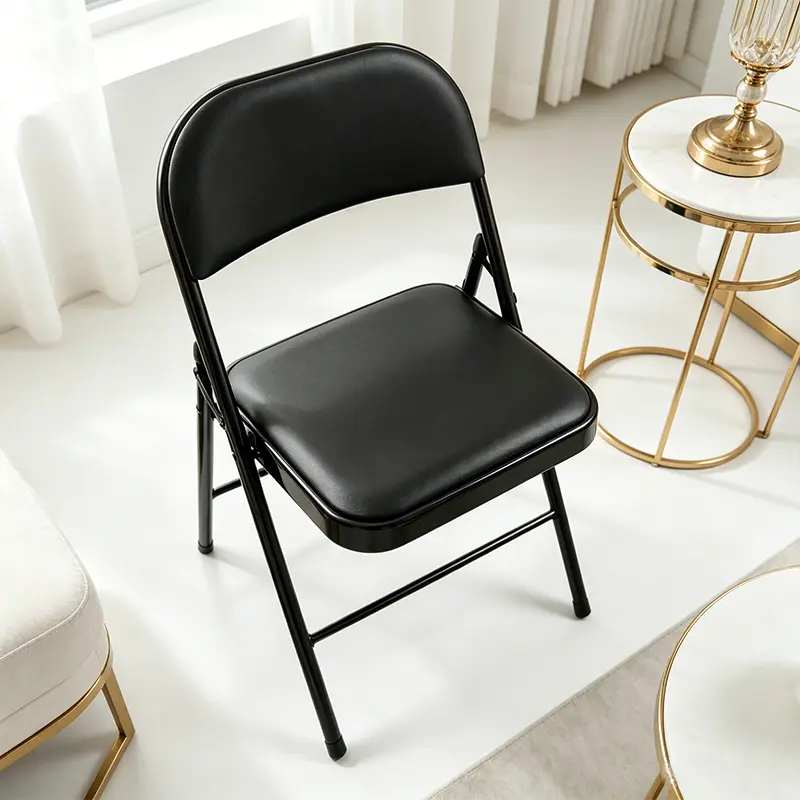 Black metal folding chair with padded seat and backrest; portable foldable activity chair for indoor/outdoor dining, weddings, and parties; stackable folding chair suitable for home banquets and offices.