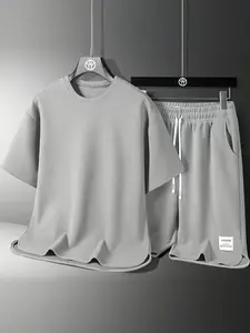Men’s casual athletic set for summer: loose, breathable, quick dry design featuring a crew neck long sleeve T shirt and drawstring shorts; men’s waffle set suitable for weekend leisure.