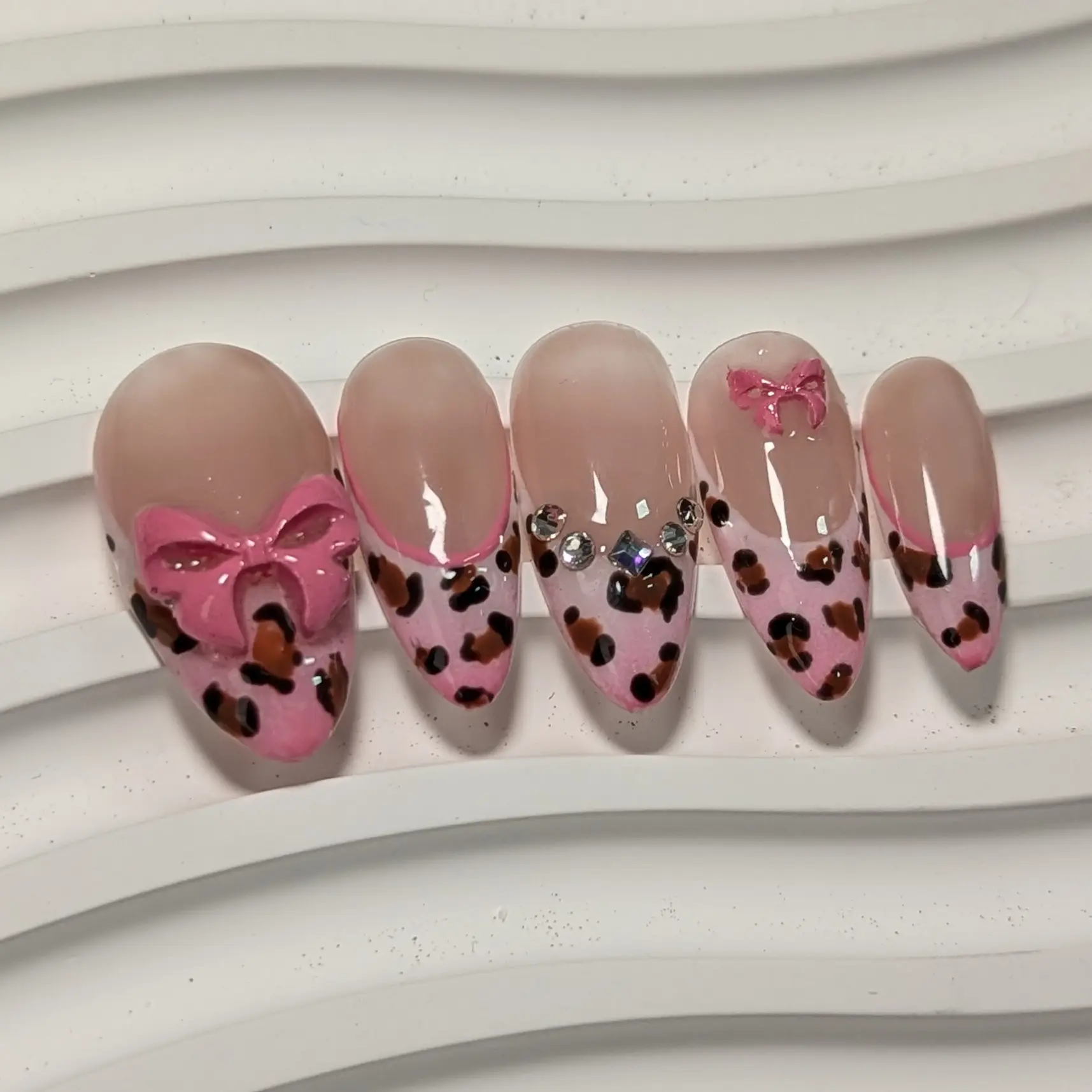 Cheetah Print Gel-x Press-on Nails with Bow in Pink - Custom Ombre French Tip Almond Shape for Glossy Finish