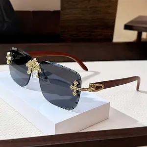 Luxurious rimless fashion glasses featuring a decorative cross design and wood-grain temples — stylish metal frame, gradient lenses, starlight accents; suitable for both men and women, perfect for casual or fashionable looks.