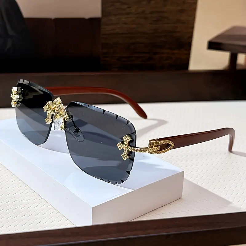 Luxurious rimless fashion glasses featuring a decorative cross design and wood-grain temples — stylish metal frame, gradient lenses, starlight accents; suitable for both men and women, perfect for casual or fashionable looks.